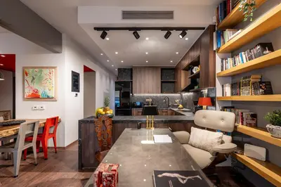 a kitchen and living room with a table and chairs at The Architect s Loft in Athens