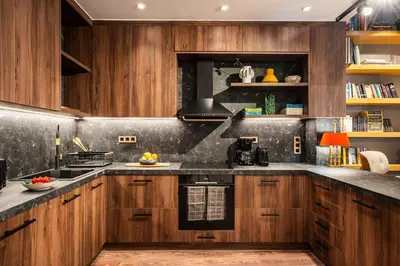 a kitchen with wooden cabinets and a counter top at The Architect s Loft in Athens