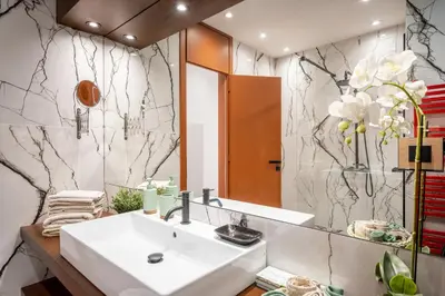 a bathroom with a sink and a mirror at The Architect s Loft in Athens