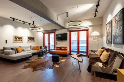 a living room with two couches and a table at The Architect s Loft in Athens