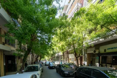 a city street with cars parked on the street at The Architect s Loft in Athens