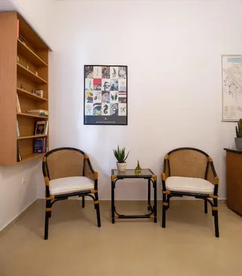 two chairs and a table in a room at Cute Retro Apartment In Exarchia Neighborhood in Athens
