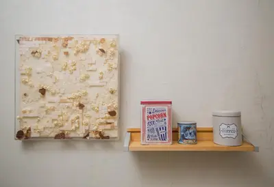 a shelf with a painting and a coffee cup on it at Cute Retro Apartment In Exarchia Neighborhood in Athens