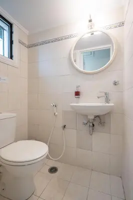 a bathroom with a toilet and a sink at Monastiraki Aélia Apartment by ΜΡS in Athens