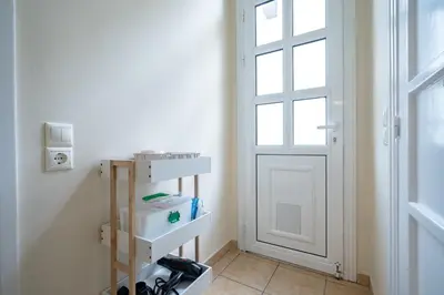 a room with a white door and a shelf at Monastiraki Aélia Apartment by ΜΡS in Athens