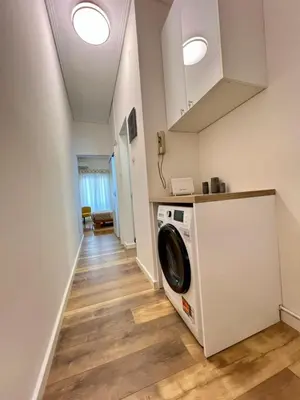a laundry room with a washer and dryer at Bright and stylish Acropolis studio in Athens