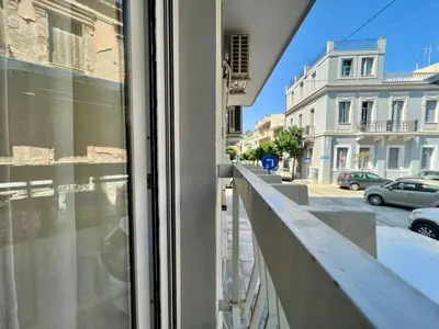 a view from a window of a street with buildings at Bright and stylish Acropolis studio in Athens