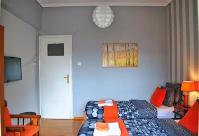 a living room with a bed and a couch at Athens SmArt 3-Room Private Apartment in Athens