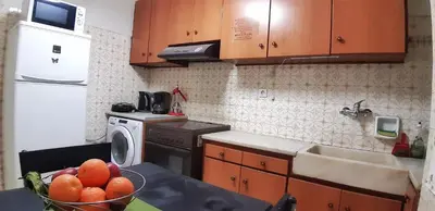 a kitchen with a bowl of fruit on a counter at Athens SmArt 3-Room Private Apartment in Athens
