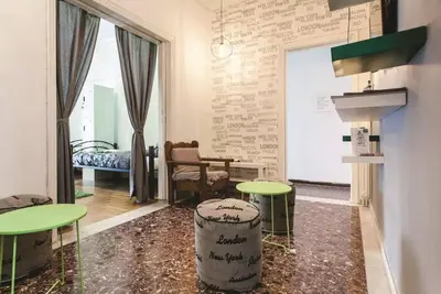 a room with two tables and a room with a bed at Athens SmArt 3-Room Private Apartment in Athens