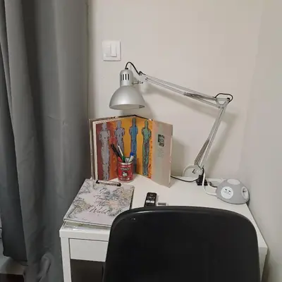 a desk with a lamp and books and a chair at Skipper's Urban Endeavor One bed lux central quiet smart cozy apart Athens in Athens