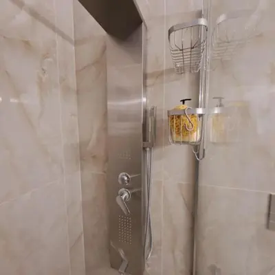 a shower with a glass door in a bathroom at Skipper's Urban Endeavor One bed lux central quiet smart cozy apart Athens in Athens