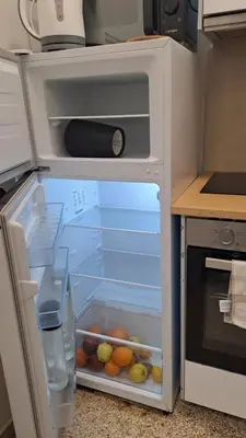 a refrigerator with its door open in a kitchen at Skipper's Urban Endeavor One bed lux central quiet smart cozy apart Athens in Athens
