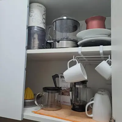 a cupboard filled with dishes and other kitchen items at Skipper's Urban Endeavor One bed lux central quiet smart cozy apart Athens in Athens