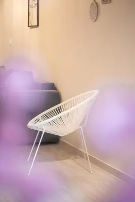 a white bench sitting next to a couch at Koukaki Comfort - Modern 2BR near Acropolis by ΜΡS in Athens