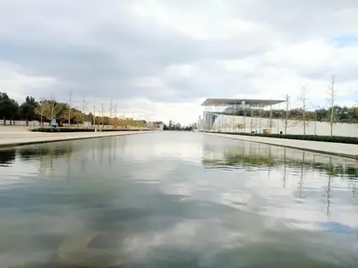 a view of a river with a building in the background at GreenGarden Comfort in Athens