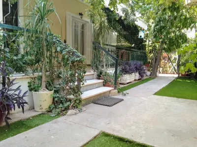 a house with a garden with stairs and plants at GreenGarden Comfort in Athens