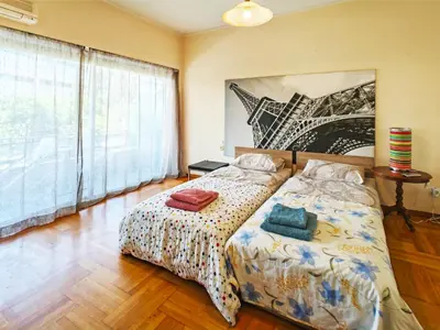 a bedroom with a bed and a large window at Oulang Easy Stay apartment - Athens Center in Athens