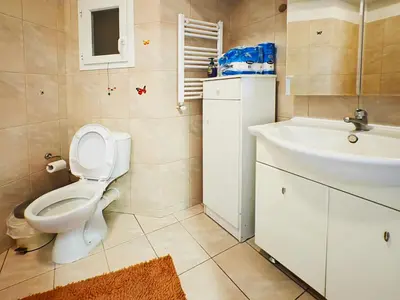 a bathroom with a toilet and a sink at Oulang Easy Stay apartment - Athens Center in Athens