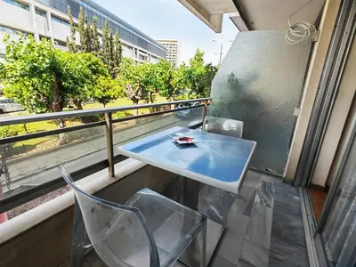 a table and chairs on a balcony with a view at Oulang Easy Stay apartment - Athens Center in Athens