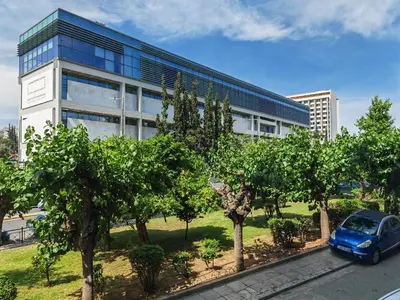 a blue car parked in front of a building at Oulang Easy Stay apartment - Athens Center in Athens