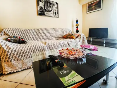 a living room with a couch and a glass table at Oulang Easy Stay apartment - Athens Center in Athens