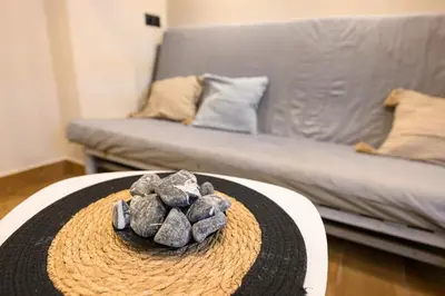 a pile of rocks on a table in a living room at Amorgou maisonette in Athens