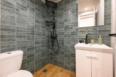 a bathroom with a toilet and a shower at Amorgou maisonette in Athens