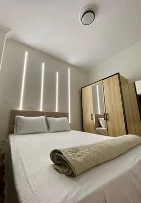 a bedroom with a large bed with white sheets at Dear Athens Suite in Athens