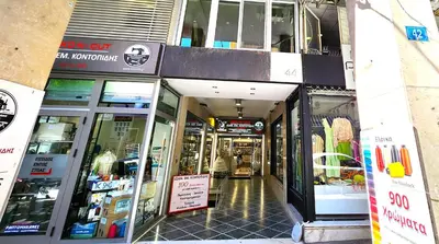 a store front of a shopping mall with its doors open at Lux Suite Jacuzzi Acropolis byMK in Athens