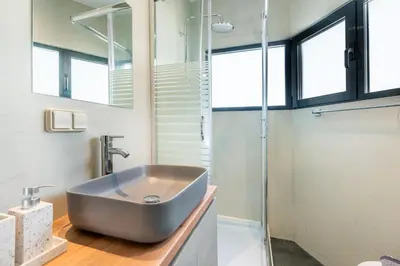 a bathroom with a sink and a shower at AURA Gazi apartments in Athens