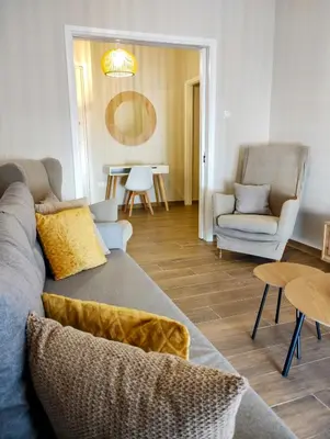 a living room with a couch and chairs and a table at Dita's Cozy Stay in Athens
