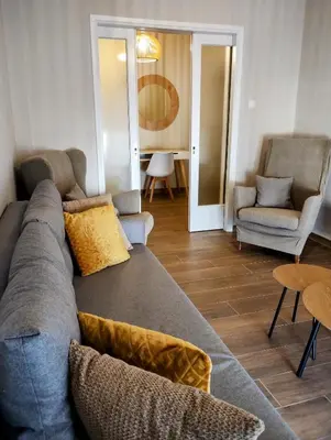 a living room with a couch and two chairs at Dita's Cozy Stay in Athens