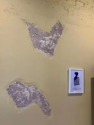 a painting of a wall with a picture on it at Sis Urban,Timeless Elegance in Athens