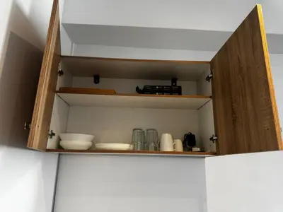 a cupboard with dishes and other kitchen items on it at Platon Loft in Athens