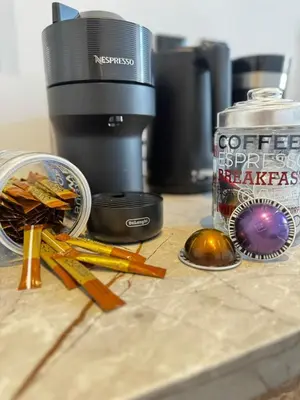 a counter top with a camera and some cinnamon sticks at Platon Loft in Athens