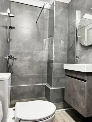 a bathroom with a toilet and a sink and a shower at Platon Loft in Athens