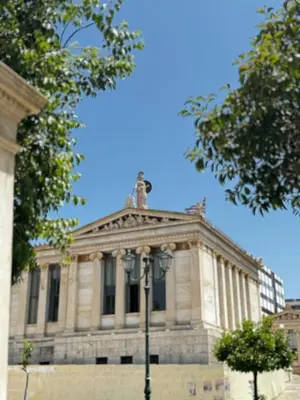 a building with a street light in front of it at Platon Loft in Athens