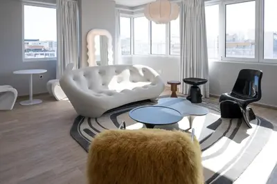 a living room with a white couch and chairs at Loft Garden of Port in Piraeus in Piraeus