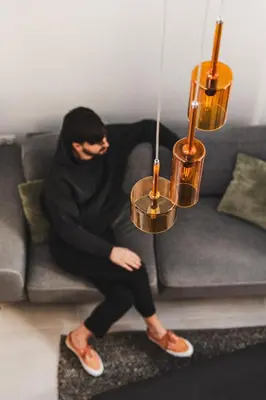 a man is sitting on a couch at Ella Luxury Suites in Athens