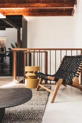 a living room with a chair and a rug at Ella Luxury Suites in Athens
