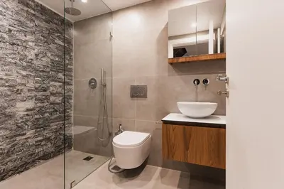 a bathroom with a shower and a toilet and a sink at Ella Luxury Suites in Athens