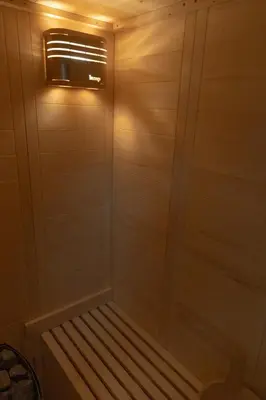a walk in shower with a window in a room at Apartment with jacuzzi and sauna in Athens