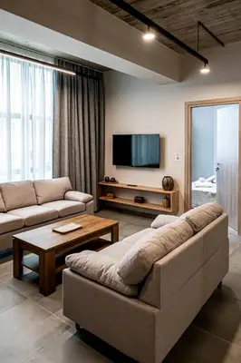 a living room with a couch and a flat screen tv at Vintage Road Apartment in Piraeus in Piraeus