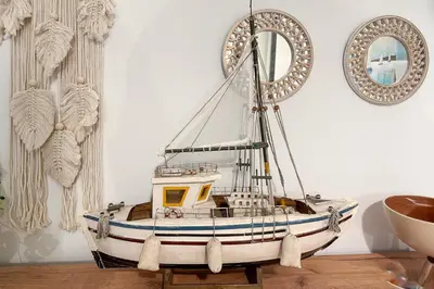 a model of a boat sitting on a table at Cozy Apartment in Exarchia, Walk to Athens Museum in Athens