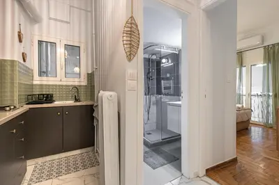 a kitchen with a shower and a sink and a bathroom at Cozy Apartment in Exarchia, Walk to Athens Museum in Athens