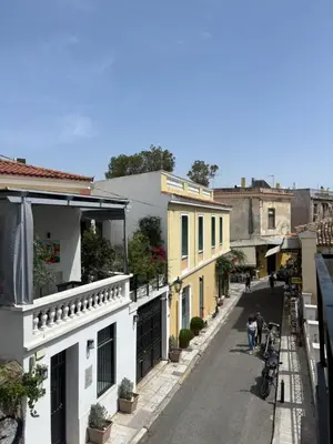 an empty street in a city with buildings at Plaka's Central, Cozy and Comfort Home in Athens