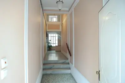 a hallway with stairs leading to a room with a ceiling at Best House Electra Pasalimani Piraeus in Piraeus