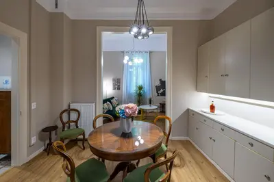 a kitchen and dining room with a table and chairs at Acropolis slow living apt - Ground floor in Athens