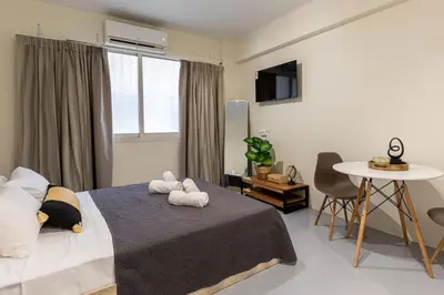 a bedroom with a bed with two stuffed animals on it at Nobia 3 in Athens